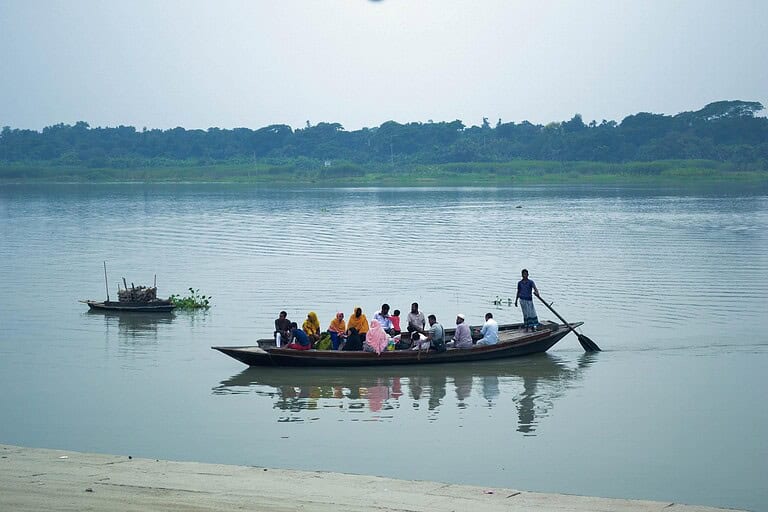 People traveling on a riverboat.